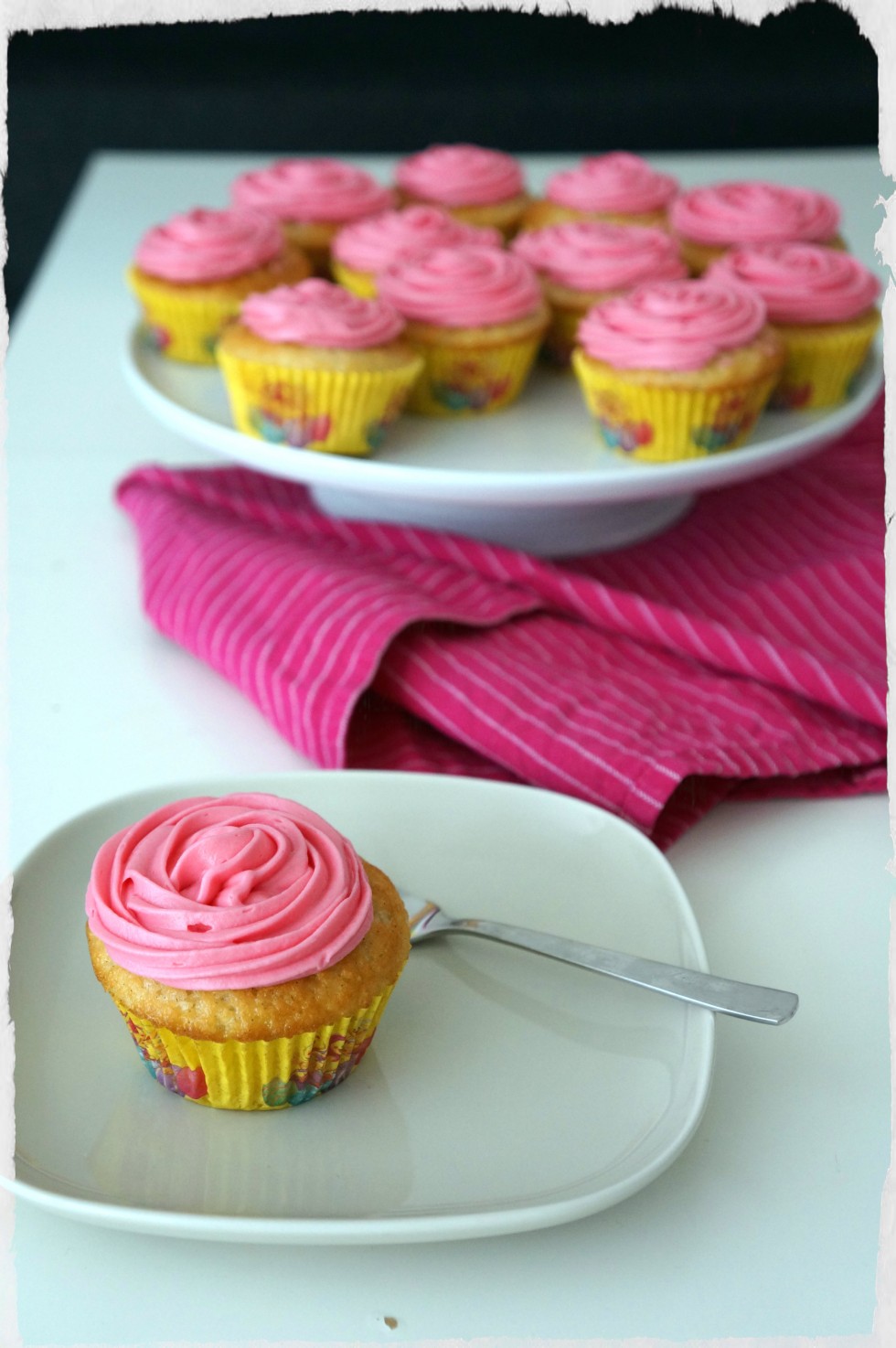 Vanilla cupcakes with rose cream cheese frosting