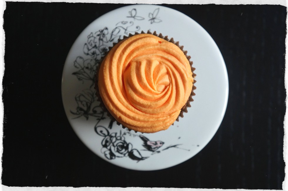 brownie cupcake with orange cream cheese frosting