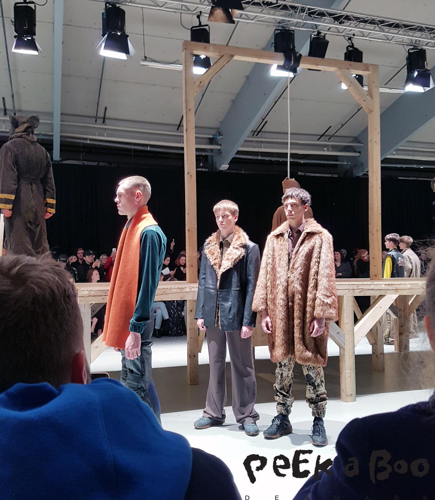 Three models after the show. Cool fur coat, and fur trim on one of the jackets, and a really cool colourpalette. 