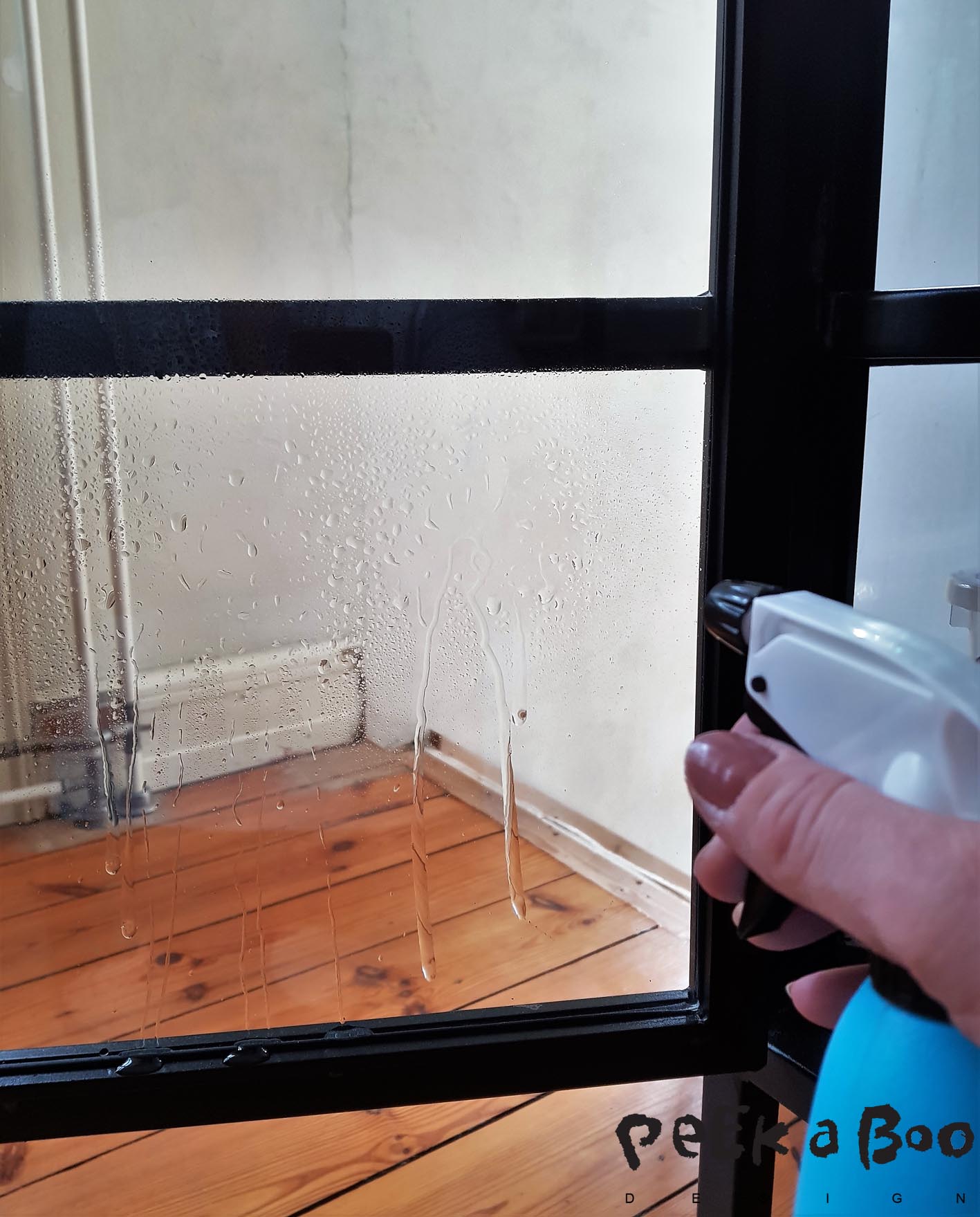 Spray water on the glass where you want to add the non-adhesive window film.