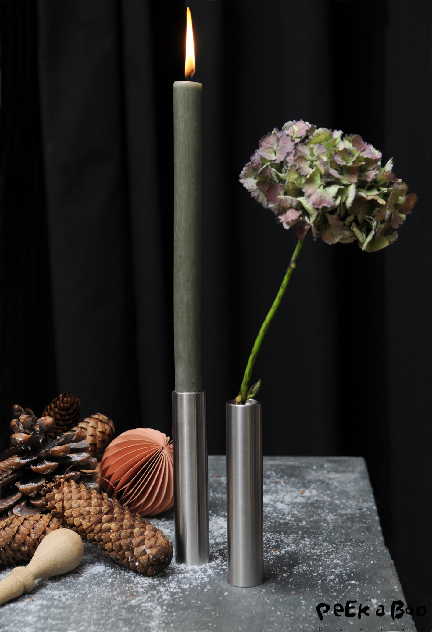 The vase and candlestick from Hove Home. It is in staninless steel and designed and produced in Denmark.