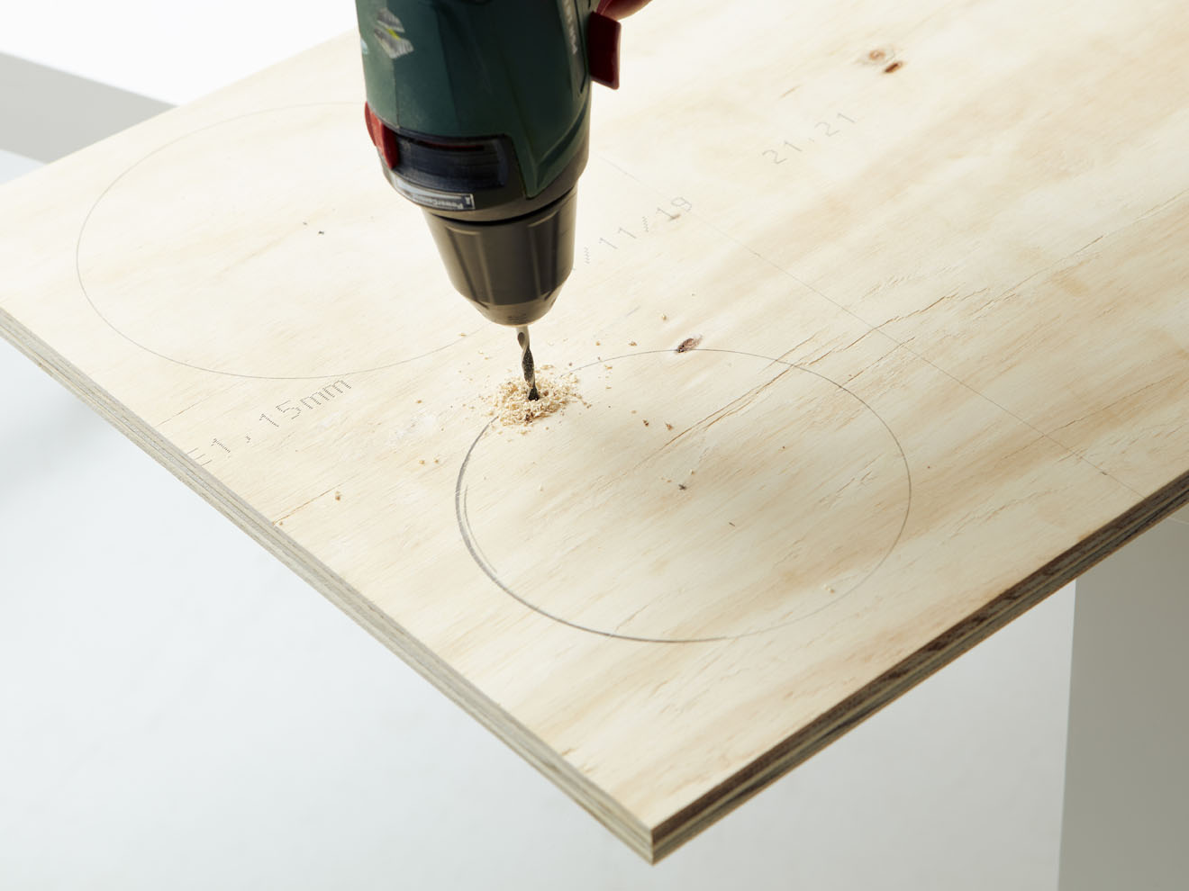 Drill a hole for your saw blade to go through.