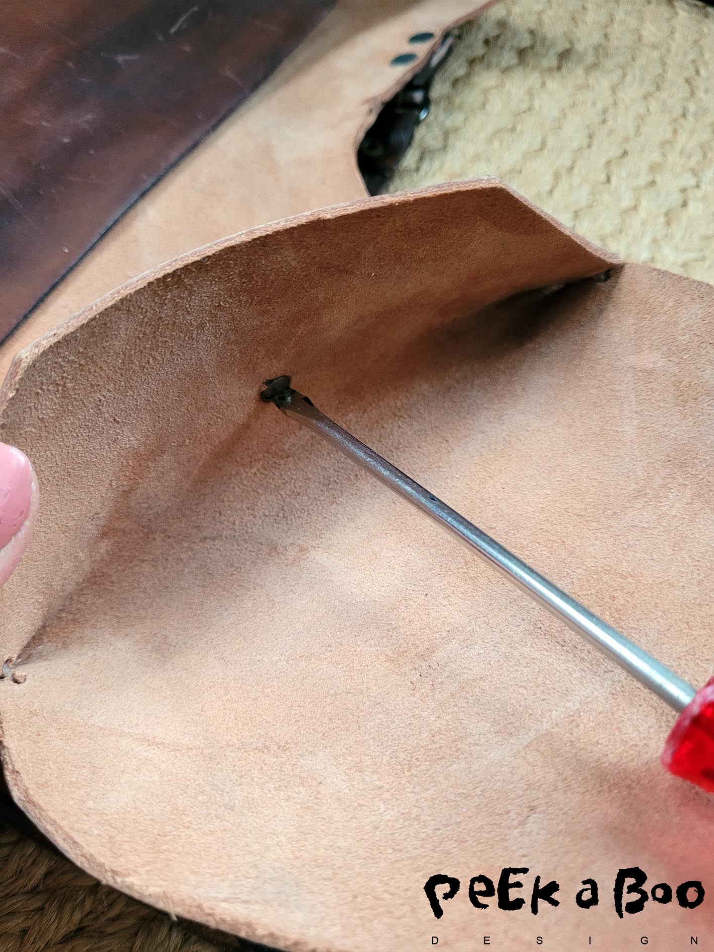 Add the button before you sew the sideseams.