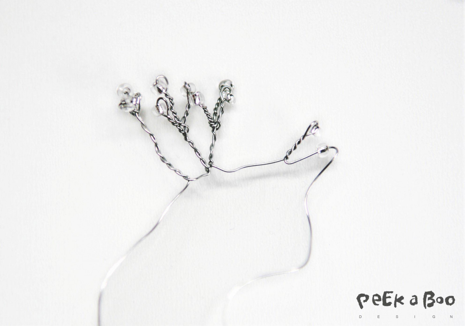 The stamen made of silver wire and seed beads in clear and silver colour and size #8.