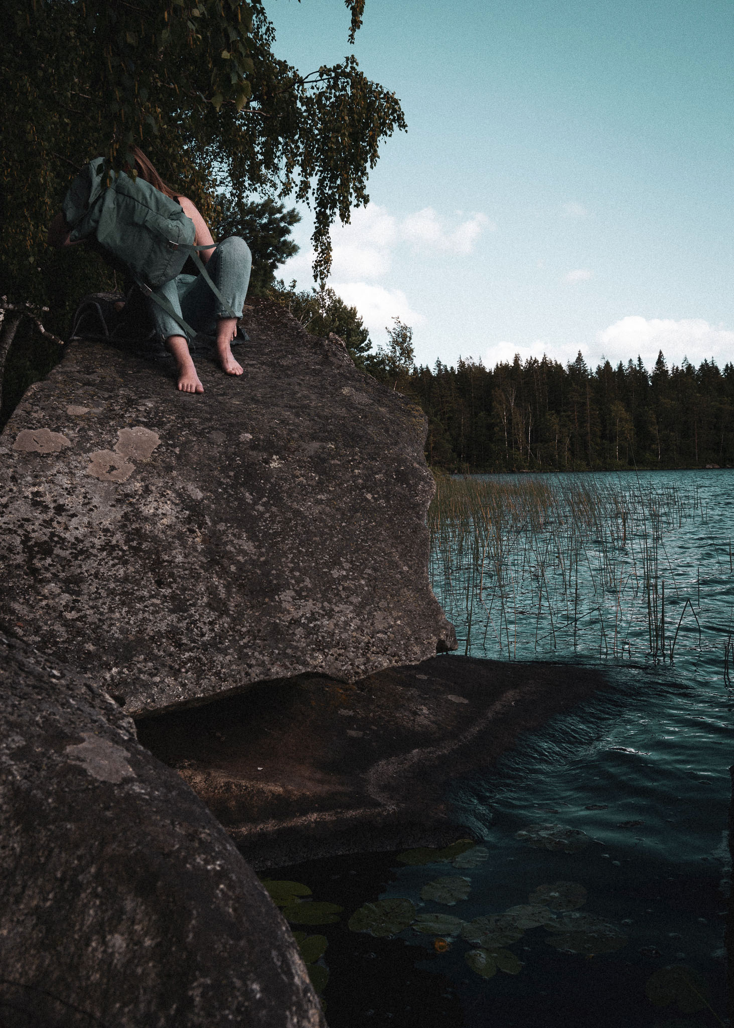 lakeside, sø, backpack, fjällräven, rocks, stories by holst, barefoot