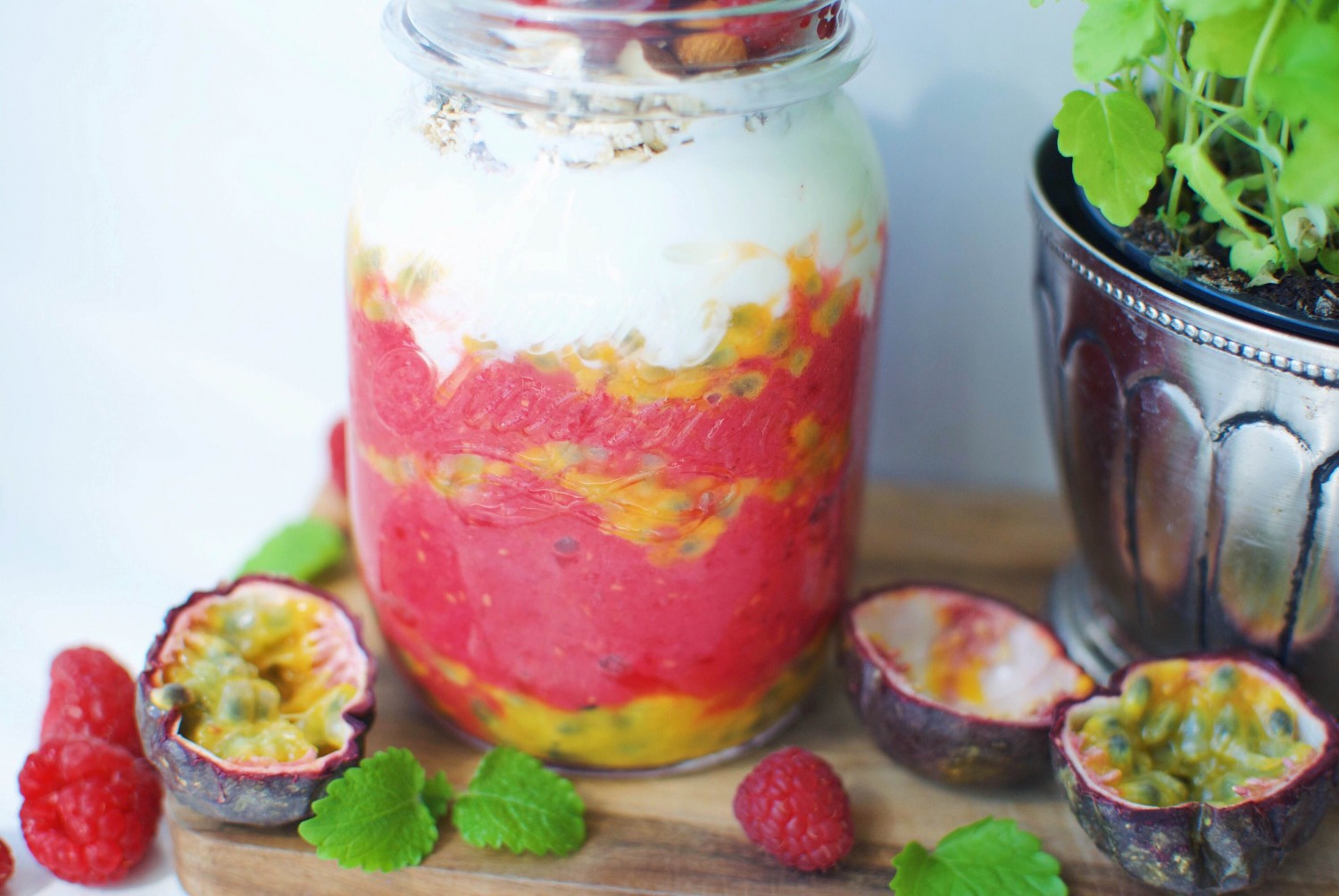 Breakfast parfait with raspberry and passion fruit