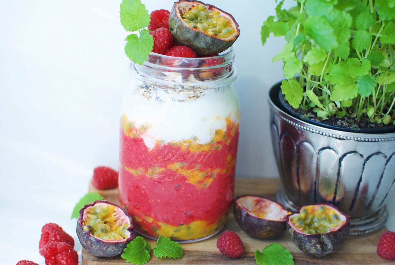 Breakfast parfait with raspberry and passion fruit
