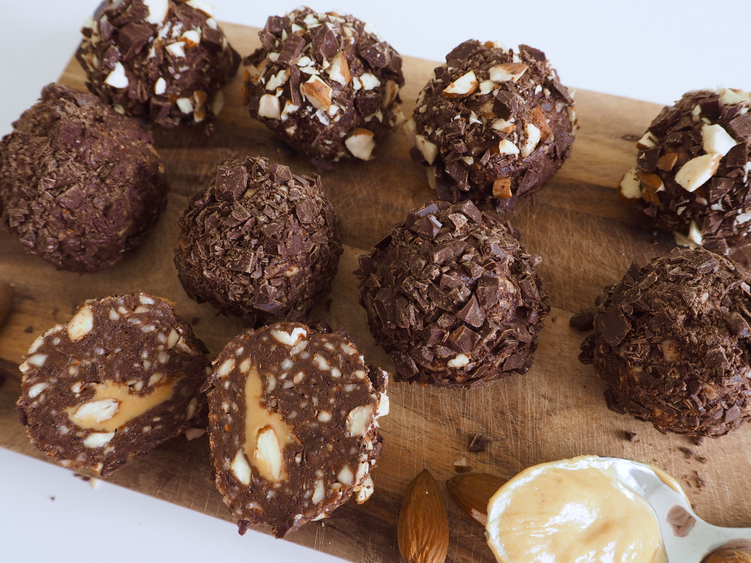 Chocolate bliss balls with a peanut butter and almond core