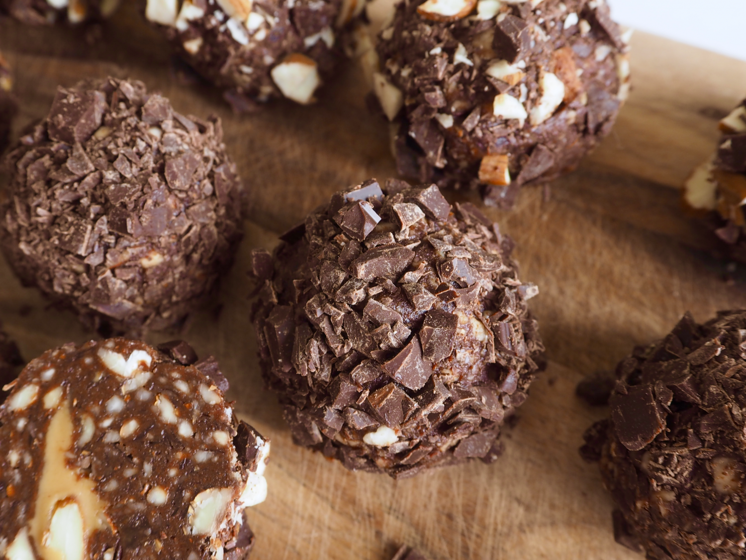 Chocolate bliss balls with a peanut butter and almond core