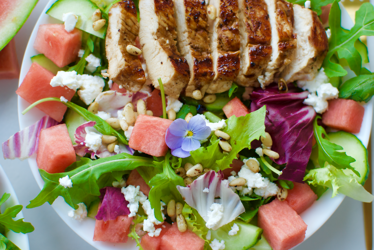 My favorite summery salad with watermelon, juicy balsamic glazed chicken, feta cheese and much more