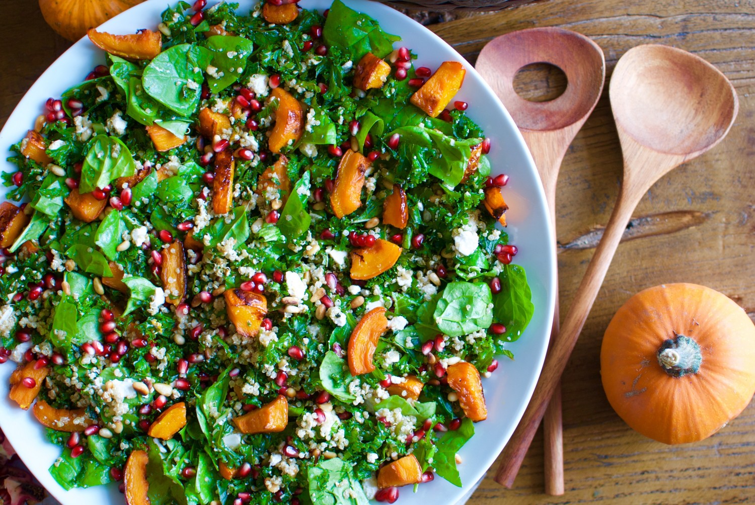 Pumpkin fall salad with pomegranate, kale and goat cheese