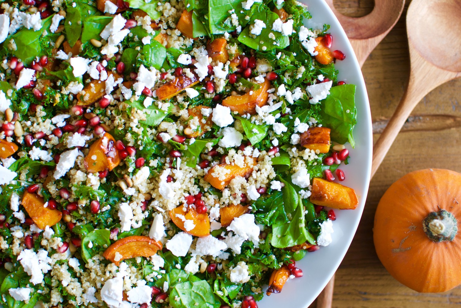 Pumpkin fall salad with pomegranate, kale and goat cheese