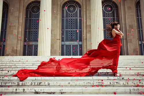 girl_in_flowing_red_dress_on_steps